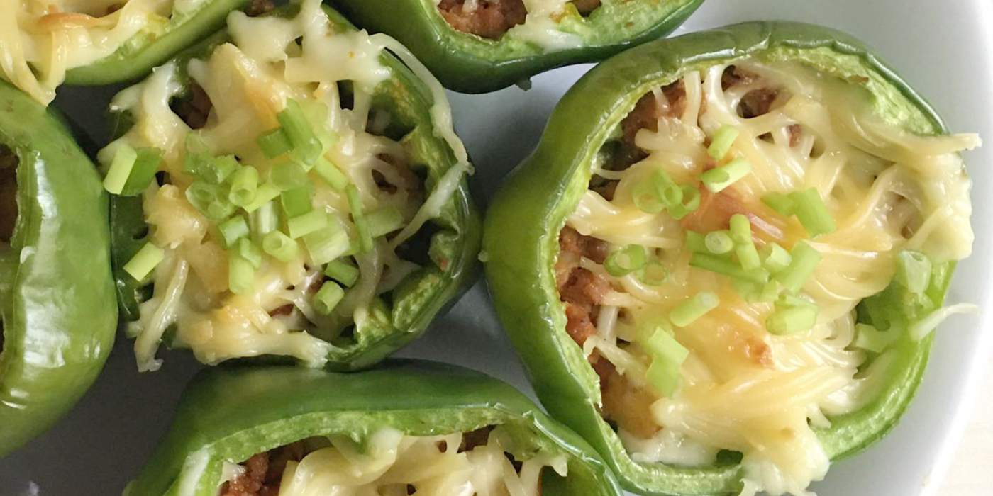 stuffed bell peppers topped with cheese and chopped chives