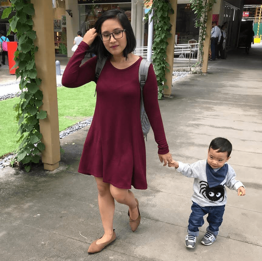 Mother and son walking in the mall