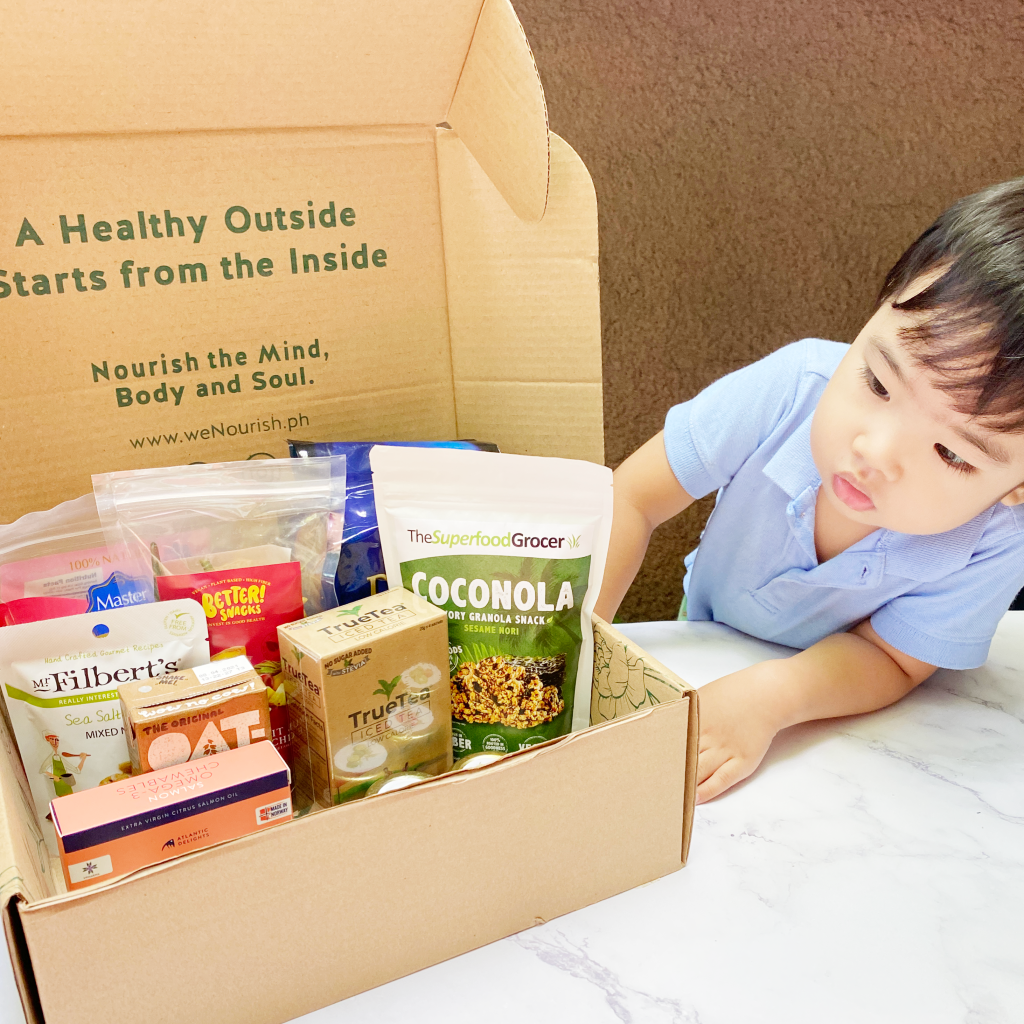 Toddler looking at a wellness box
