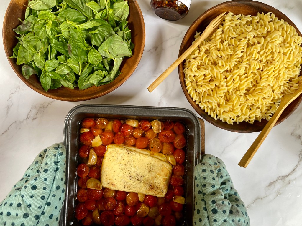 Assembling the viral tiktok baked feta pasta recipe