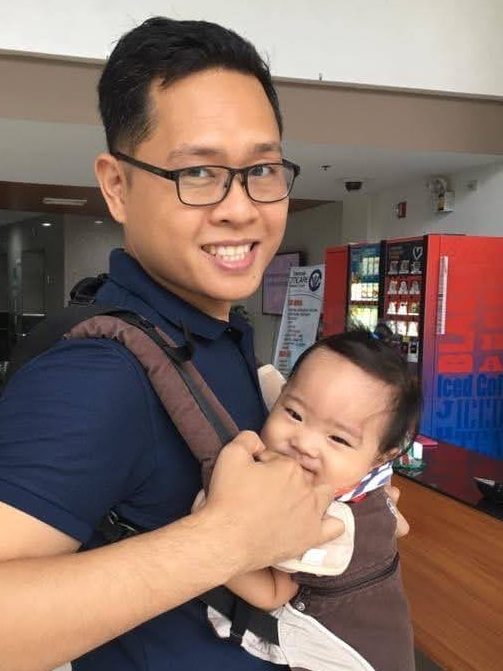 Dad using a baby carrier