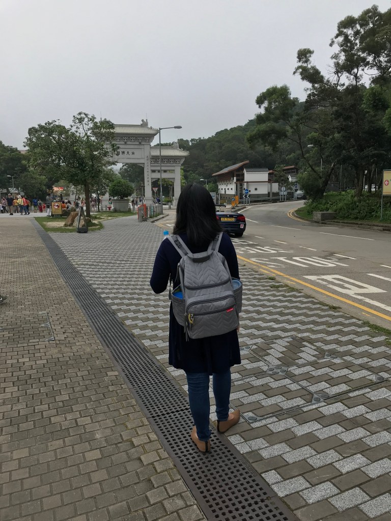 Mom walking with a diaper backpack