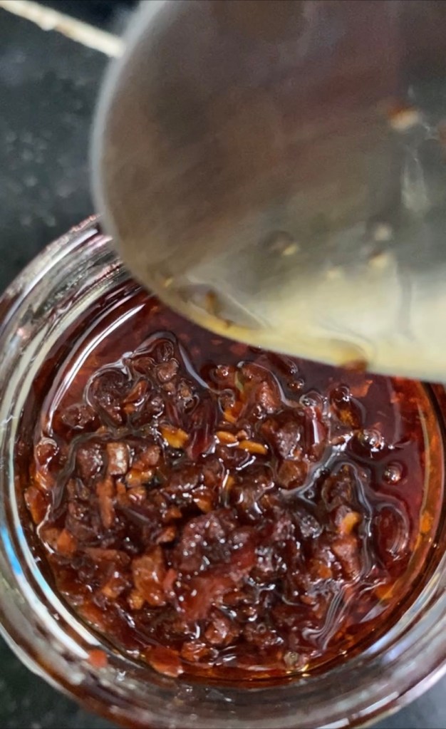 Beautifully colored chili garlic sauce in coconut oil