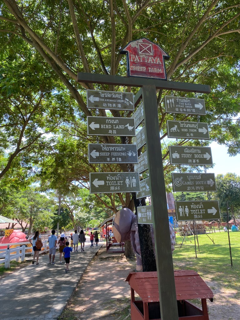 Wooden directions at the Pattaya Sheep Farm