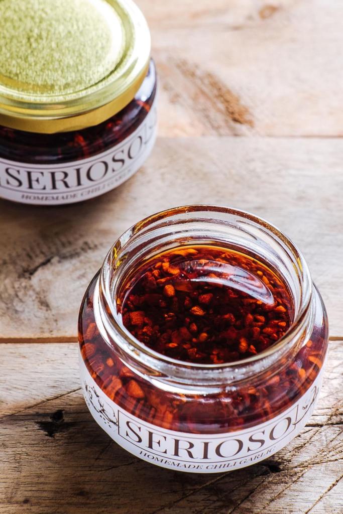 An open bottle of Serioso Chili Garlic