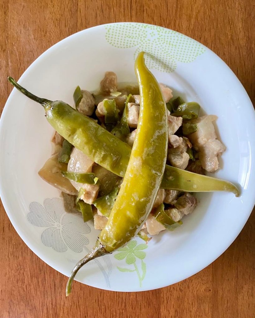 Bicol Express with two green chillies on top