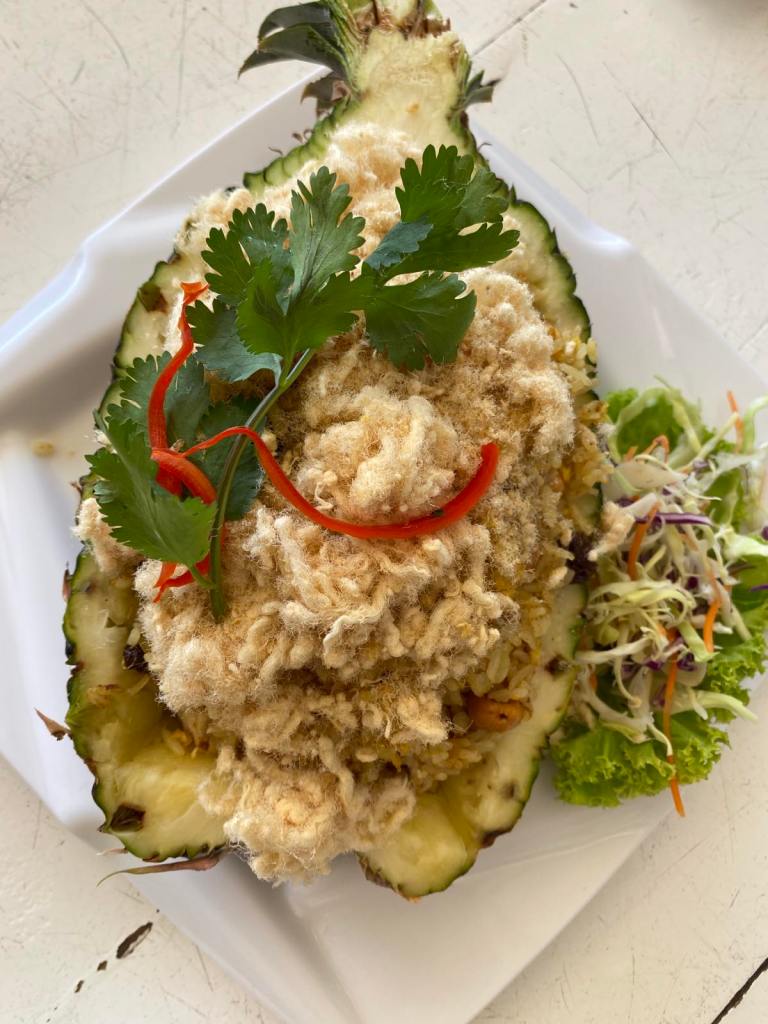 Fancy Pineapple Fried Rice served in half a pineapple