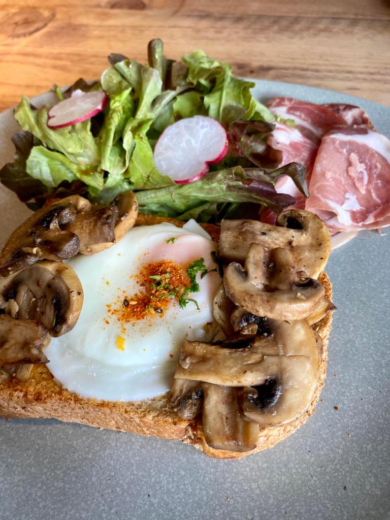 toast with mushrooms and sunny side up