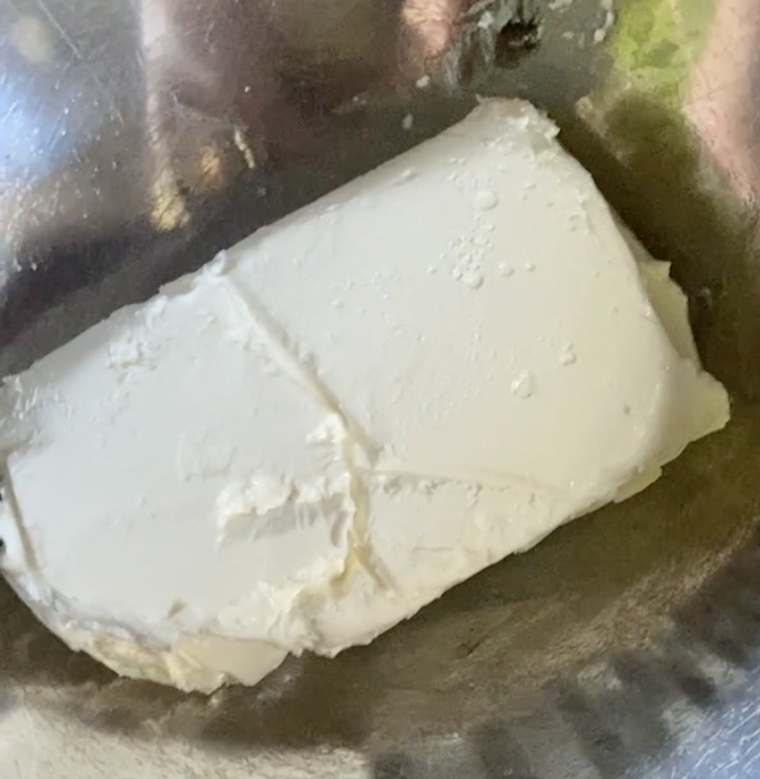 A block of cream cheese in room temperature