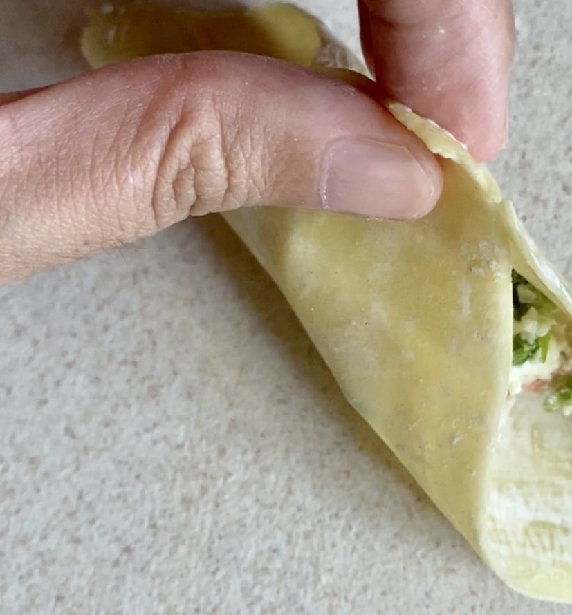 Pinching the dumpling wrapper