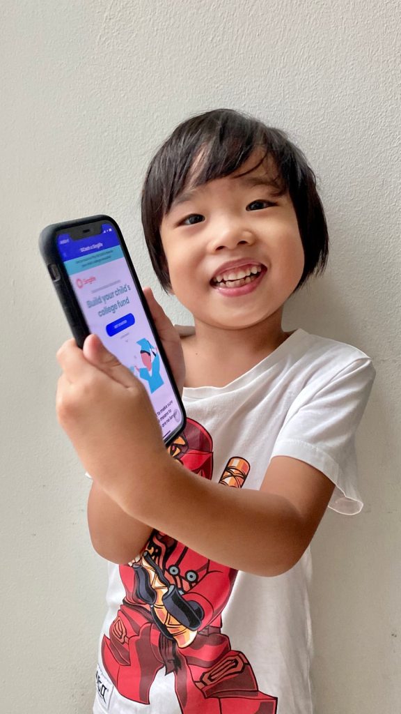 Little boy showing a finance app