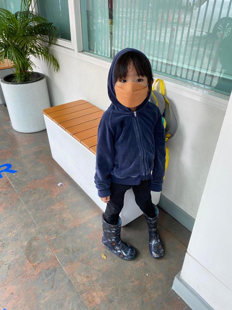 Little boy in a rainy day outfit