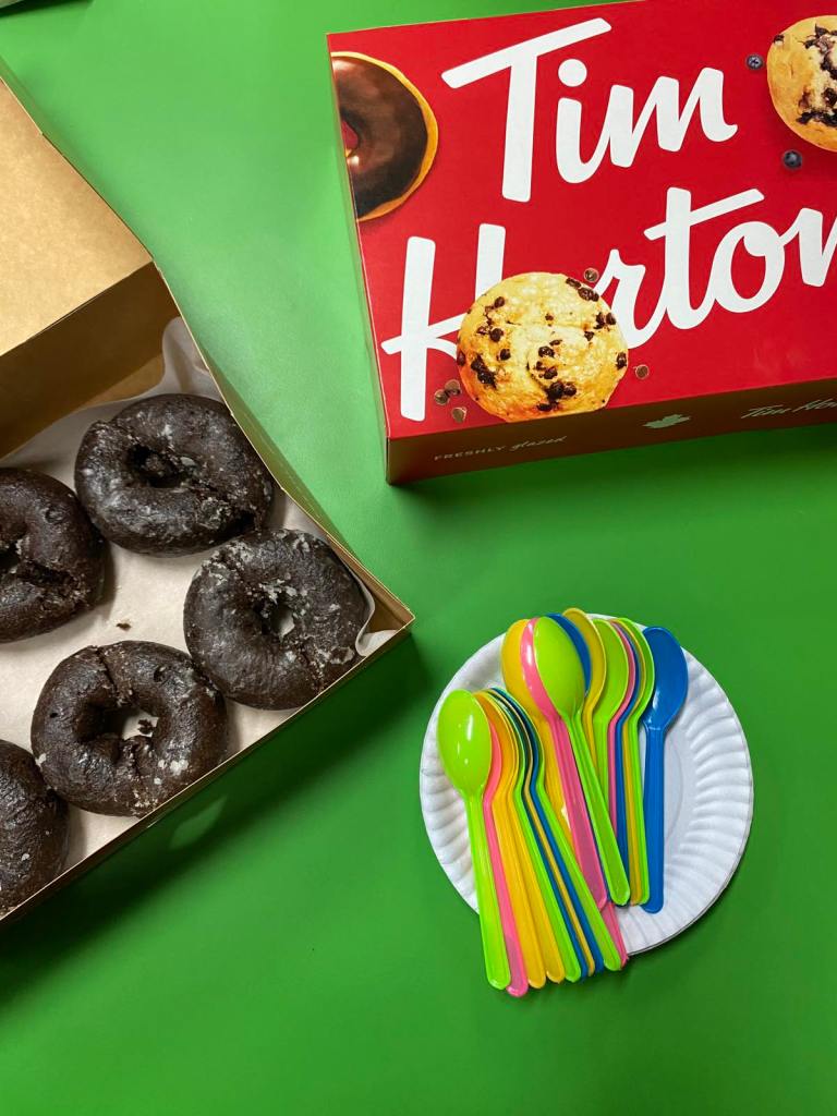 A box of tim horton's classic chocolate donuts for sharing