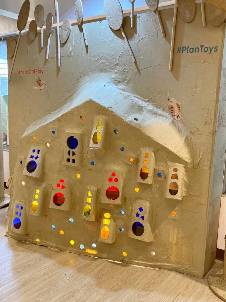 A wooden house with colorful windows