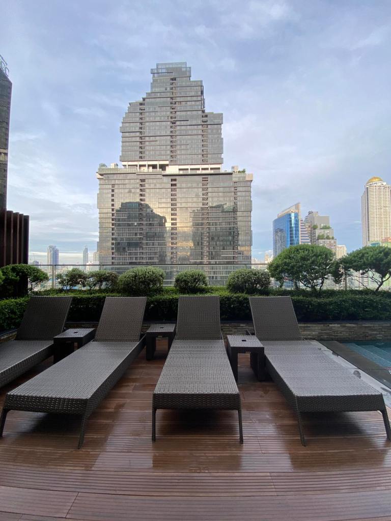 Pool chairs with a city view