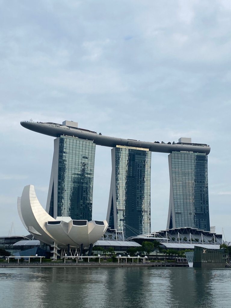 Singapore Art Science Museum building with Marina Bay Sands Hotel behind it