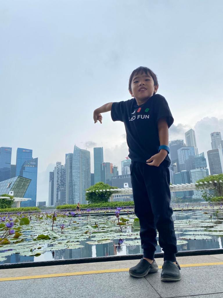Boy pointing at the tall buildings in Marina Bay Singapore