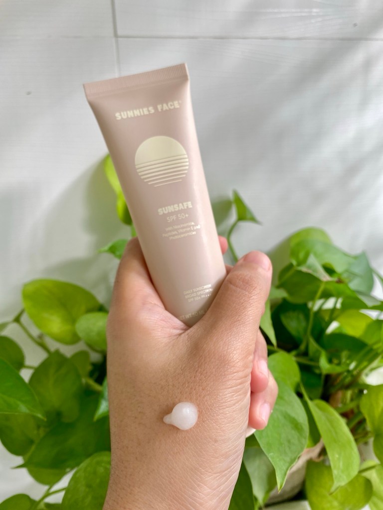 a pea-sized amount of gel sunscreen on a hand for testing