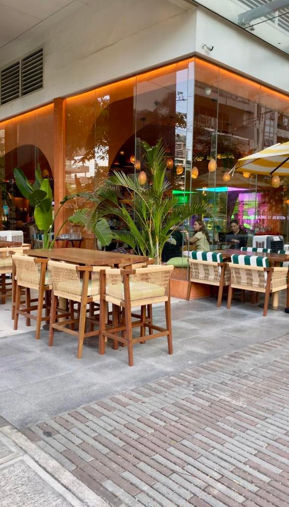 Outside an aesthetic cafe showcasing Philippine native handicrafts as furniture and a resort look