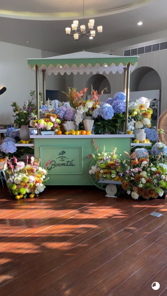 Seafoam green cart adorned with lush flowers