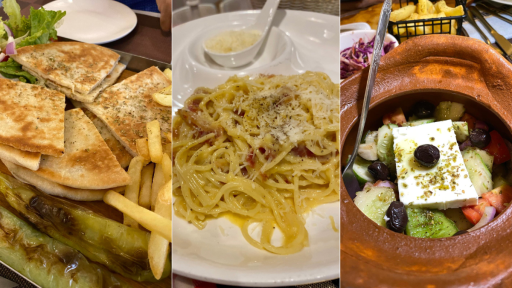 a plate of fries and wraps, a plate of carbonara and a clay pot of greek salad